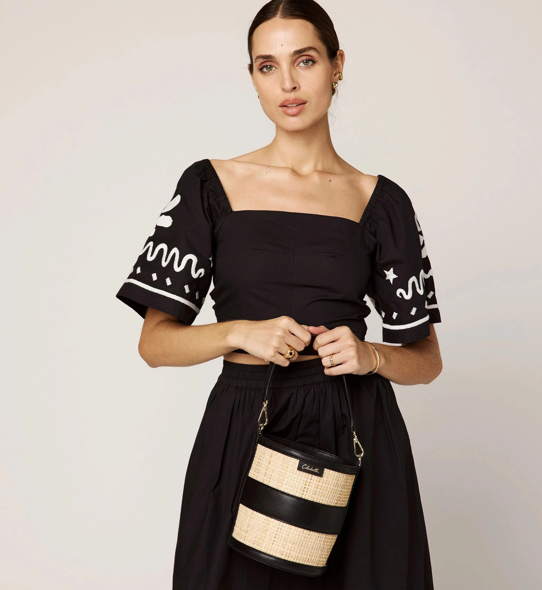 Minka Top | Black/Ivory Bonded Seam Construction Laser Cut Edges